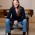 Dana sitting in a chair