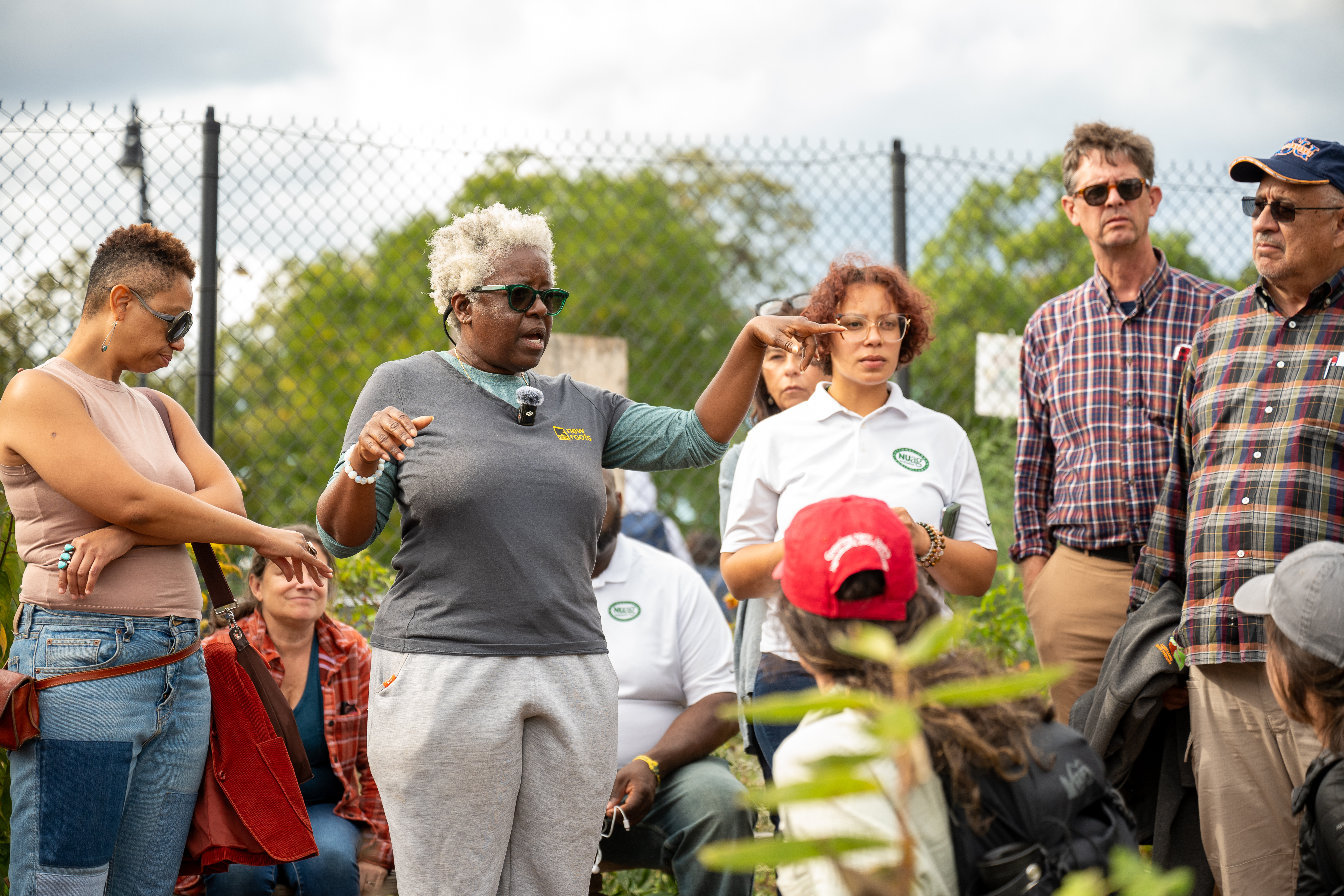 a garden leaders giving a group instructions